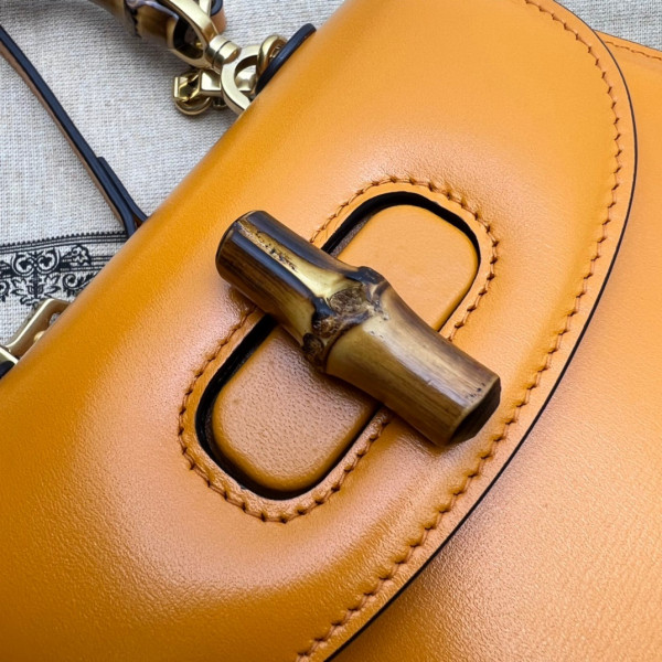 G*u*i mini top handle bag with bamboo