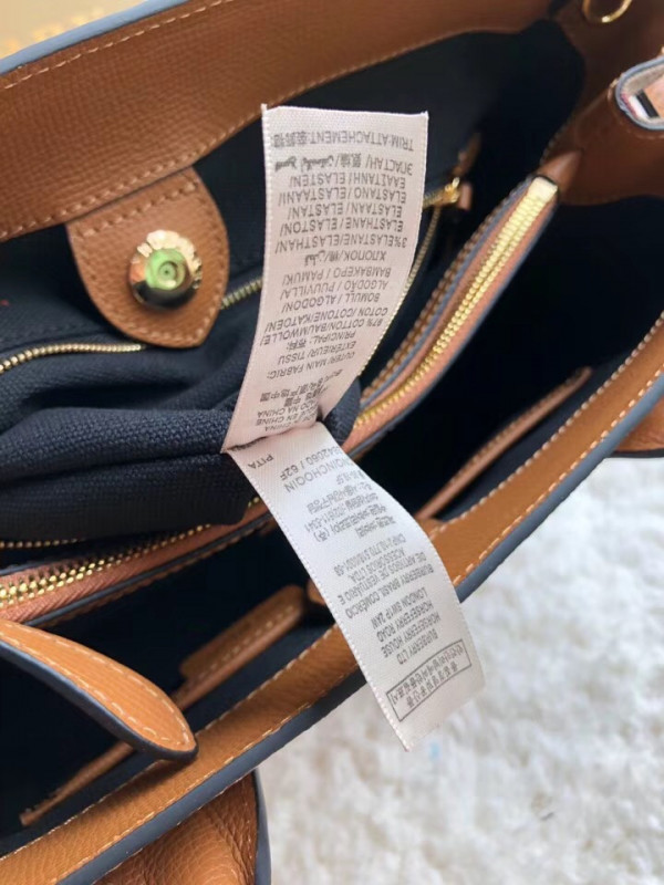 B**rry the medium banner in leather and house check